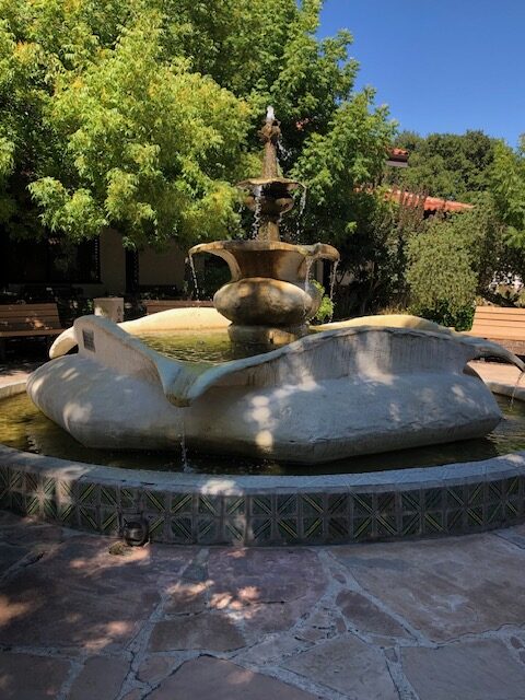 Fountain in the courtyard of San Damiano Retreat Center. Image for post on Our Annual Writer's Retreat