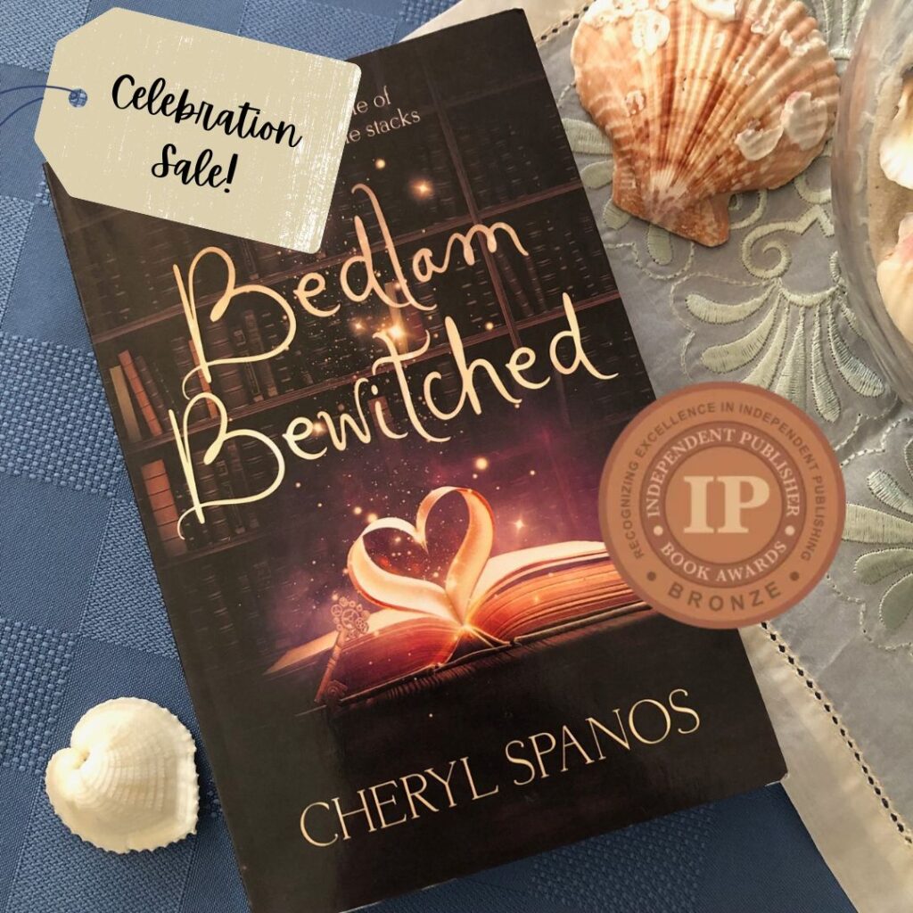 Image for Celebration Sale post showing Bedlam Bewitched book cover, IPPY Award, and sale tag