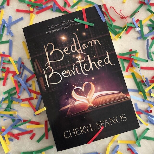Photo of Bedlam Bewitched book cover surrounded by confetti for Post on A New Year, New Goals