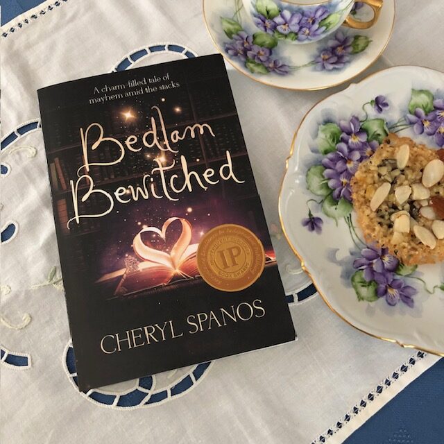 Bedlam Bewitched book with tea and cookie for Inspiring Bedlam post